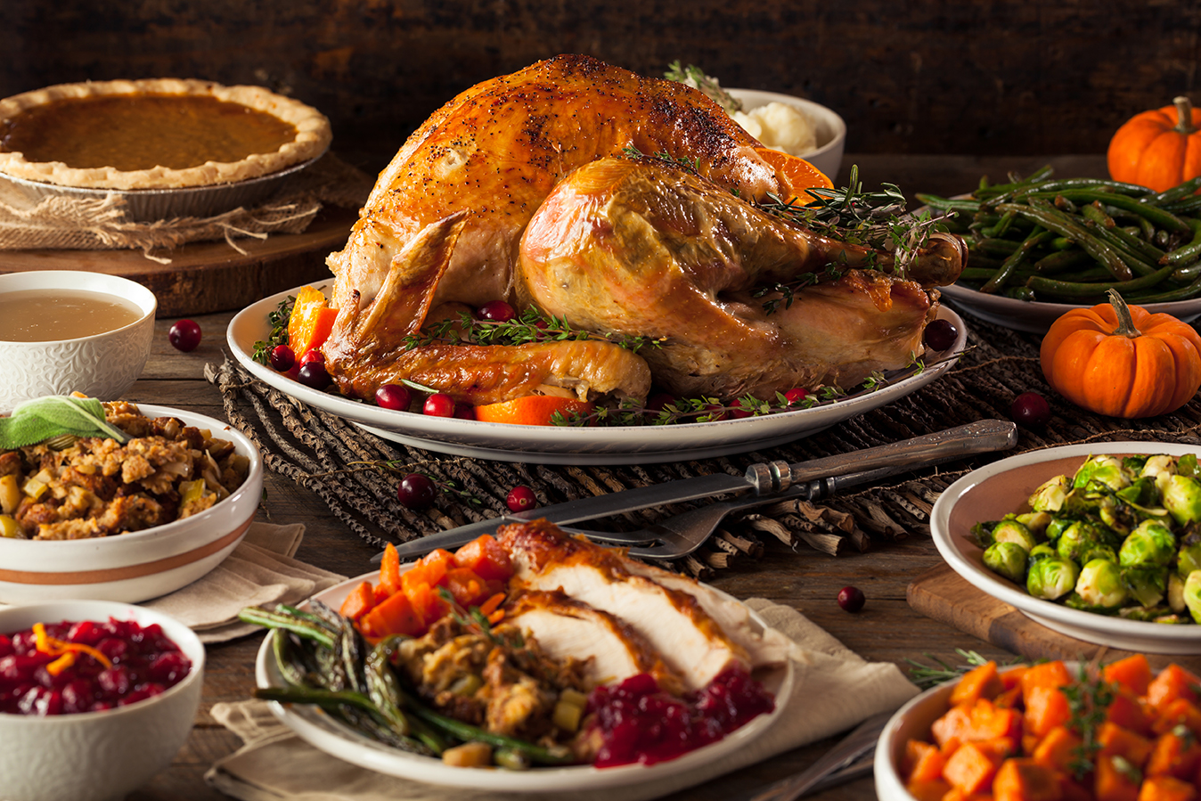 Thanksgiving table with whole roasted turkey.