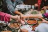 close up of a family at a table celebrating EID